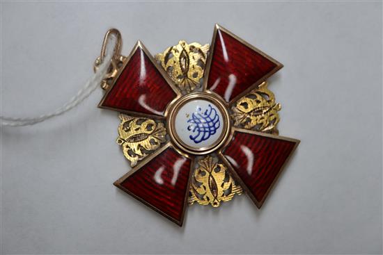 An early 20th century Russian 56 zolotnik yellow metal and enamel cross pendant and an 18ct chain, pendant 34mm.